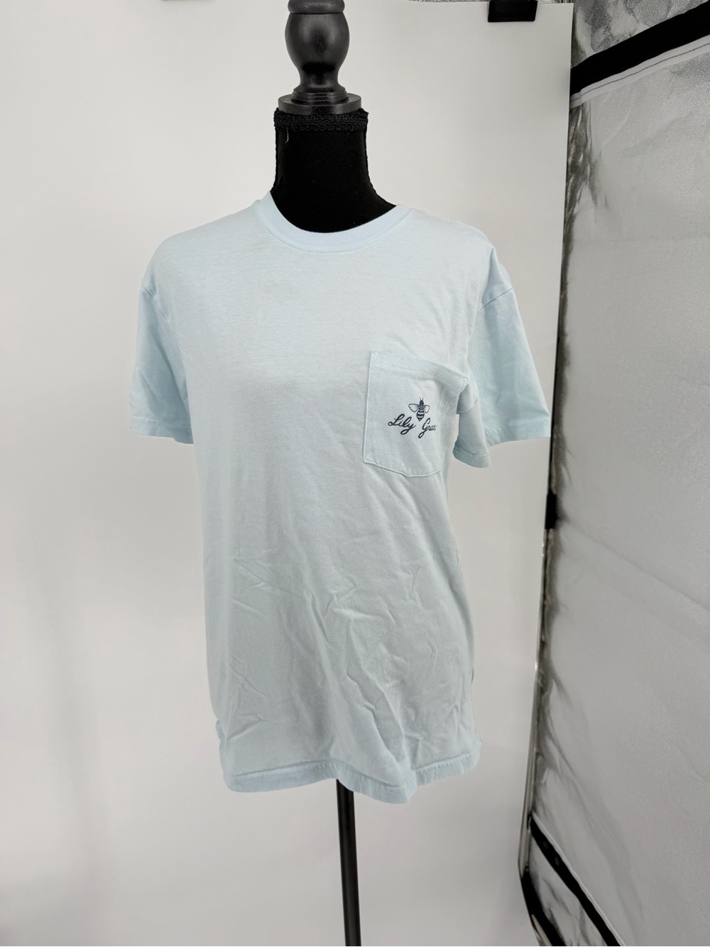 Lily Grace Light Blue Short Sleeve Pocket Tee with back graphic - Picture 1 of 7